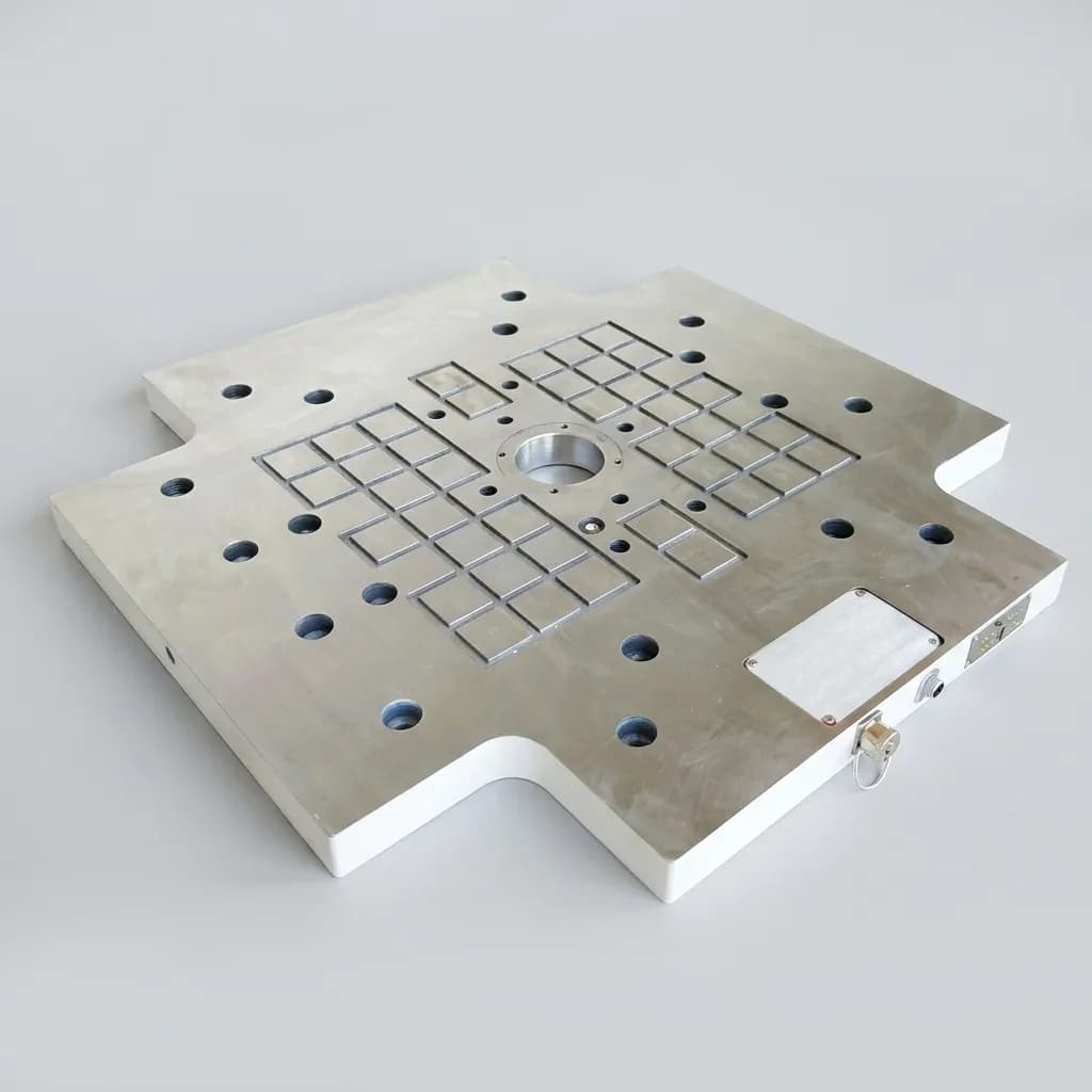 Compact magnetic gripper body for machine tending cells